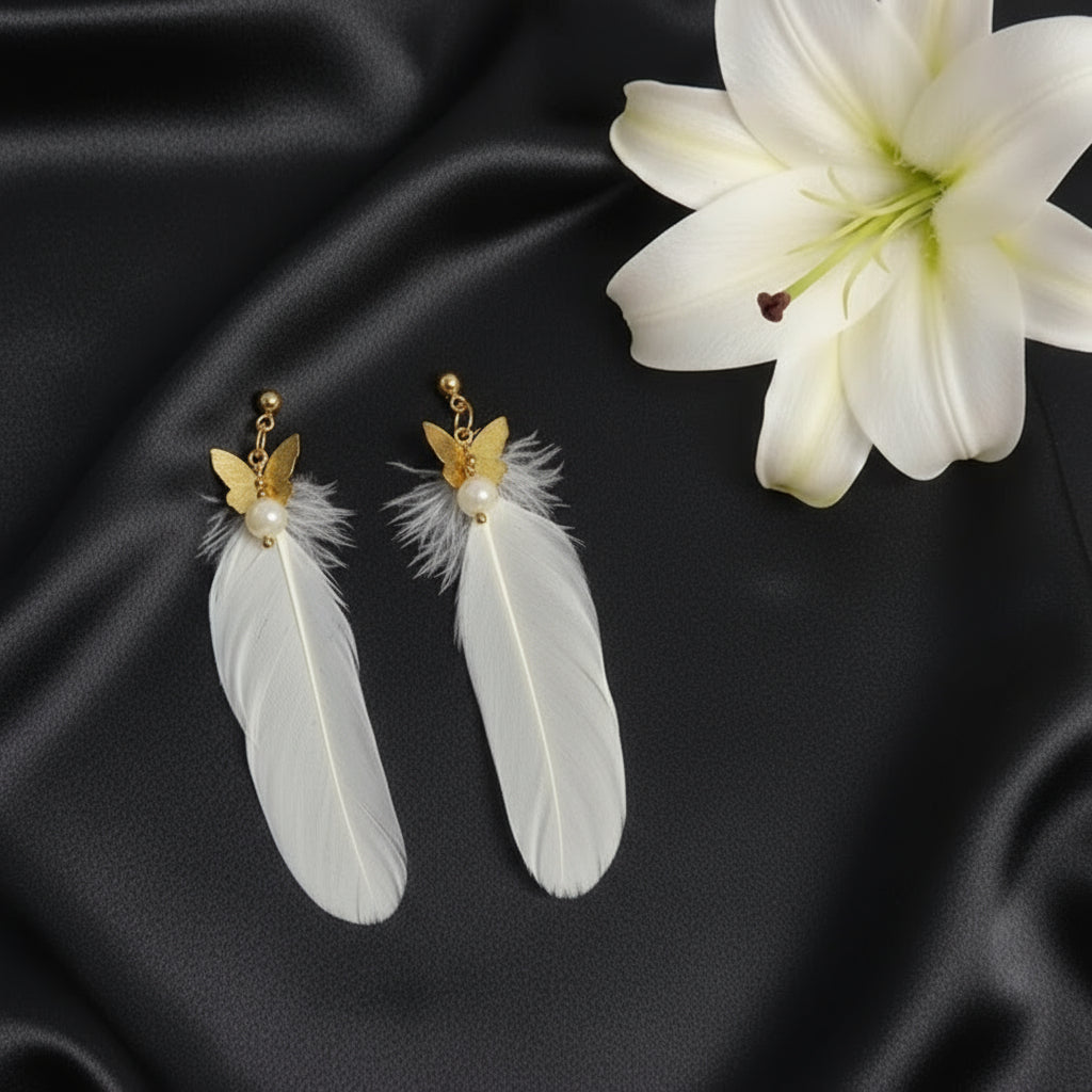 Boucles d'oreilles dorées plume céleste et pierre de lune