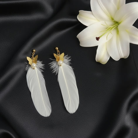 Boucles d'oreilles dorées plume céleste et pierre de lune