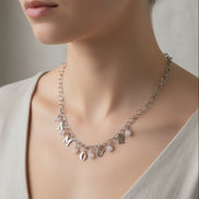Collier LovE ou AMOUR en acier inoxydable et quartz rose