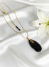 collier doré en onyx
