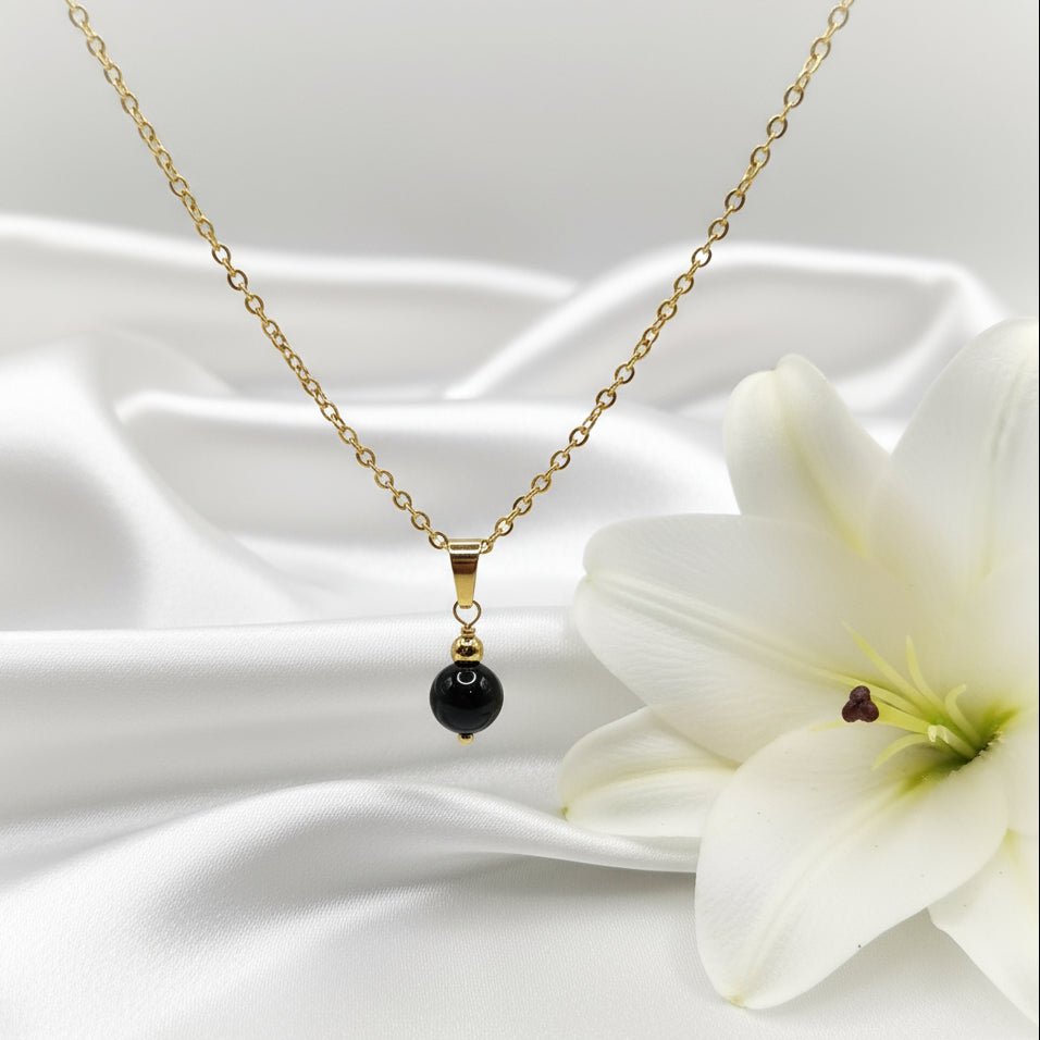 Collier et sa Perle de pierre obsidienne