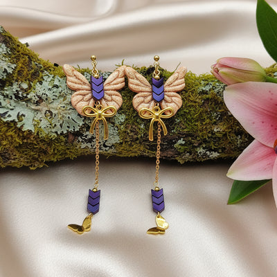 Boucles d'oreilles dorées papillon, hématite et polymère