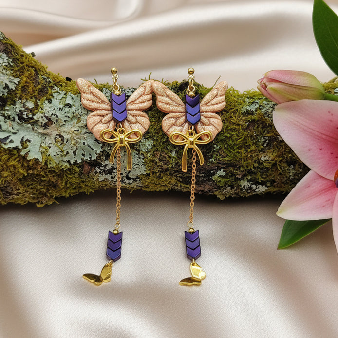 Boucles d'oreilles dorées papillon, hématite et polymère