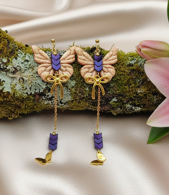 Boucles d'oreilles dorées papillon, hématite et polymère