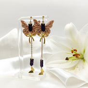Boucles d'oreilles dorées papillon, hématite et polymère