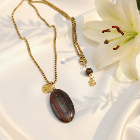 Collier long doré et oeil de fer sur bélière acier inoxydable