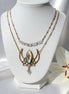 collier doré lotus et pierre