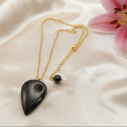 Collier doré et Pendentif en oeil de fer sur bélière acier inoxydable