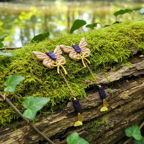 Boucles d'oreilles dorées papillon, hématite et polymère